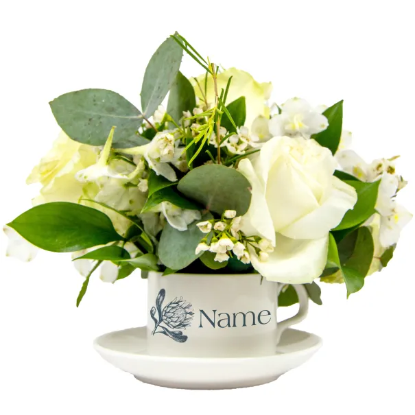 White Flower Arrangement In Tea Set Product Image